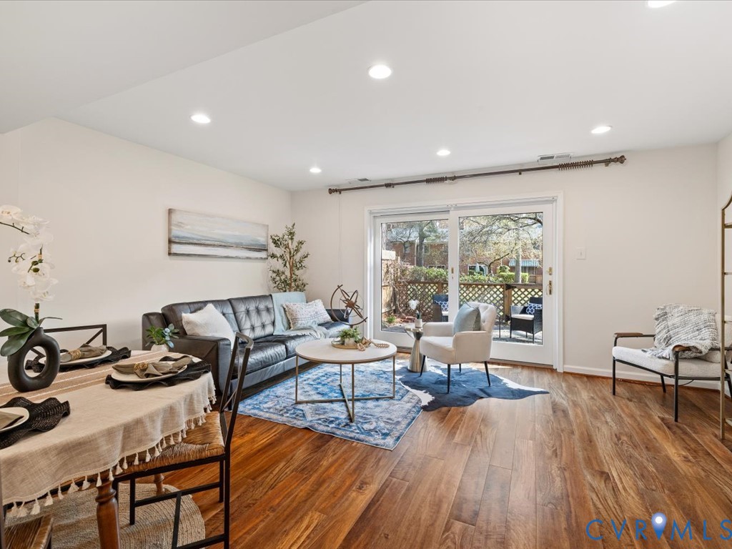 9107 Derbyshire Road, Unit J Henrico, VA 23229 - Photo 12 of 38 a living room with furniture and a wooden floor