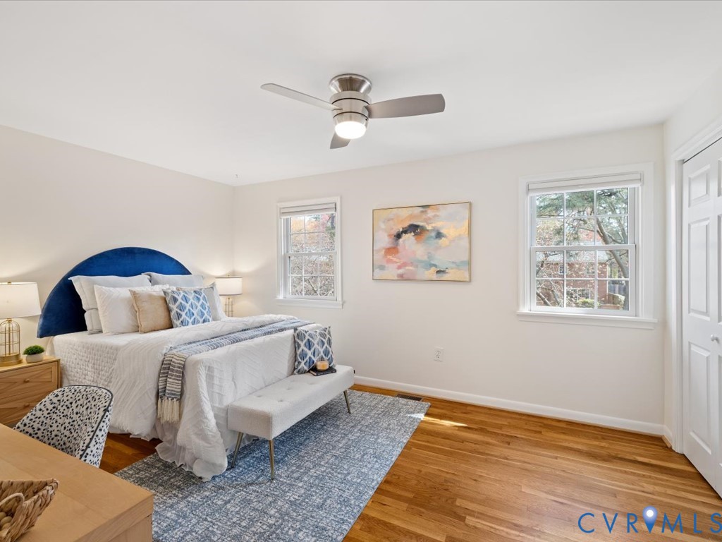 9107 Derbyshire Road, Unit J Henrico, VA 23229 - Photo 22 of 38 a bedroom with a bed and wooden floor