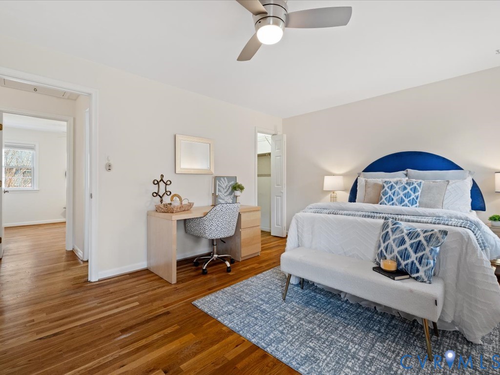 9107 Derbyshire Road, Unit J Henrico, VA 23229 - Photo 23 of 38 a bedroom with a bed and wooden floor