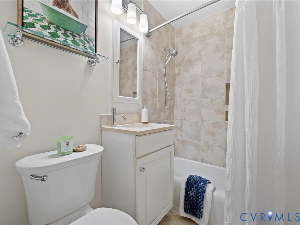 9107 Derbyshire Road, Unit J Henrico, VA 23229 - Photo 24 of 38 a bathroom with a sink a toilet and shower