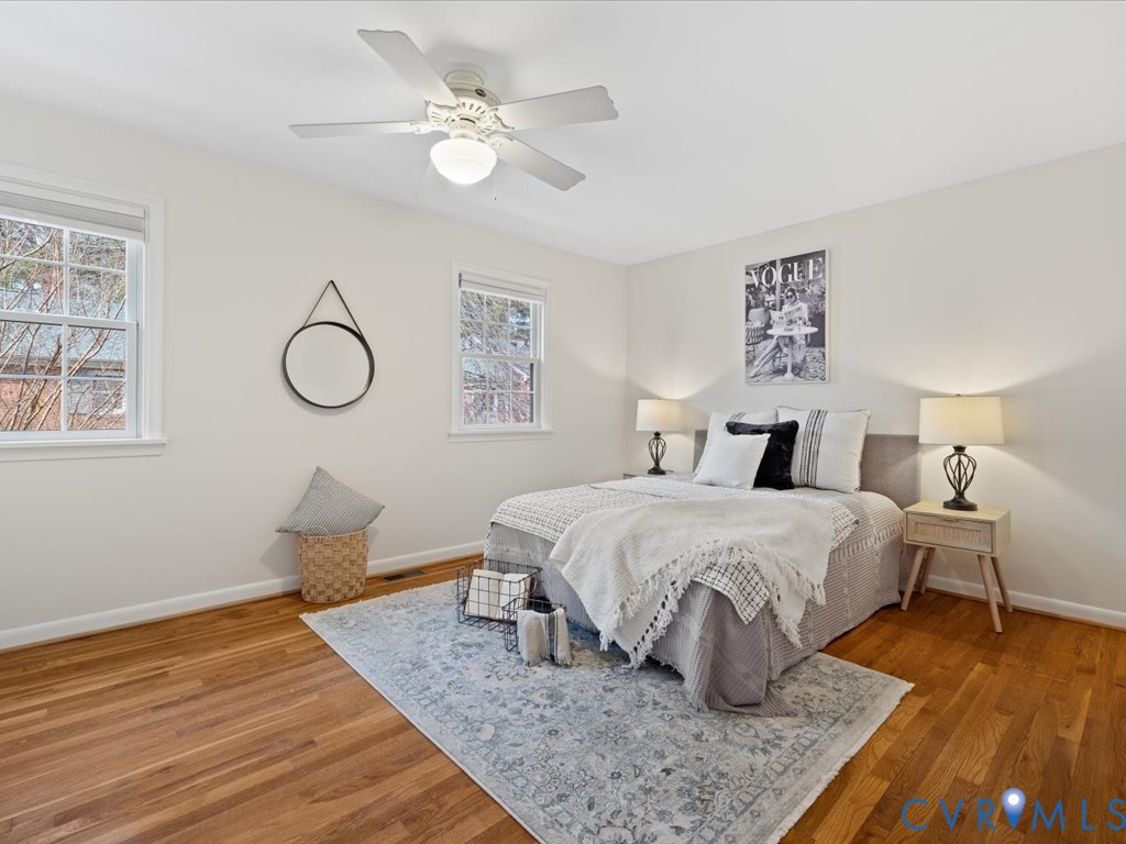 9107 Derbyshire Road, Unit J Henrico, VA 23229 - Photo 25 of 38 a bedroom with a bed and wooden floor