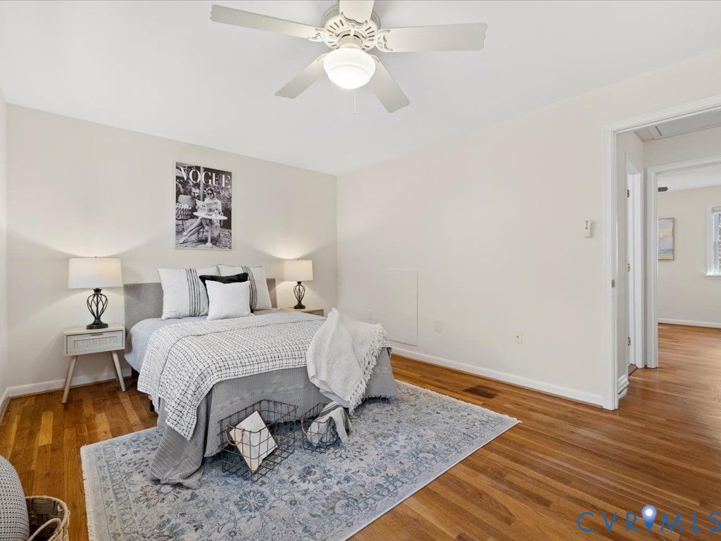 9107 Derbyshire Road, Unit J Henrico, VA 23229 - Photo 27 of 38 a bedroom with a bed and wooden floor