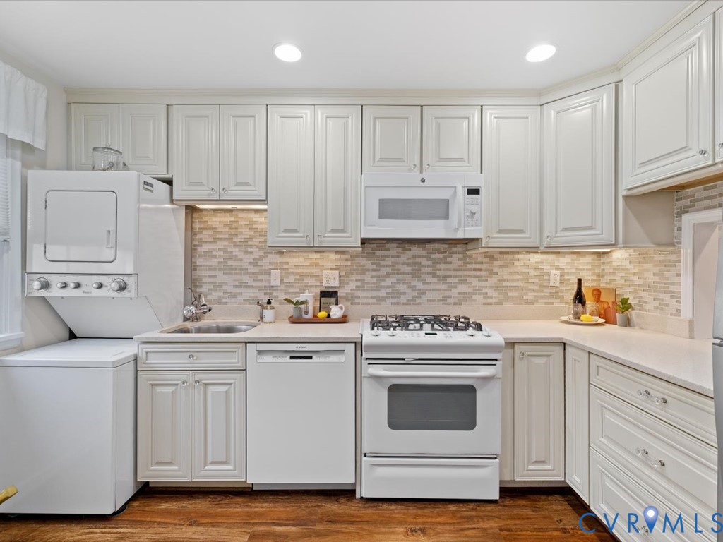 9107 Derbyshire Road, Unit J Henrico, VA 23229 - Photo 8 of 38 a kitchen with white cabinets and white appliances