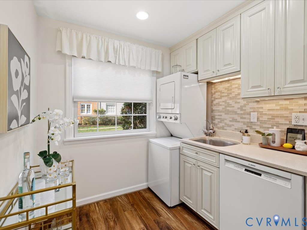 9107 Derbyshire Road, Unit J Henrico, VA 23229 - Photo 9 of 38 a kitchen with stainless steel appliances a sink a window and cabinets