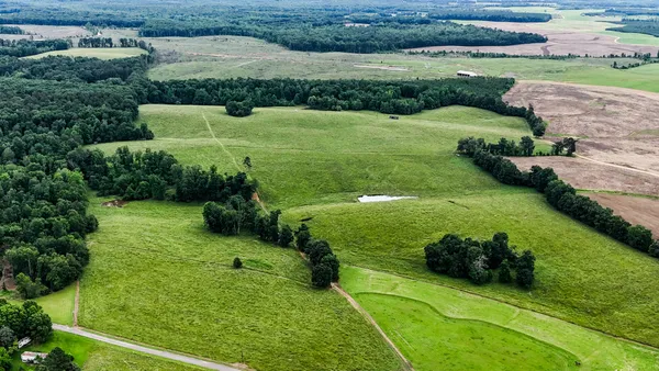 an aerial view of a golf course with a garden