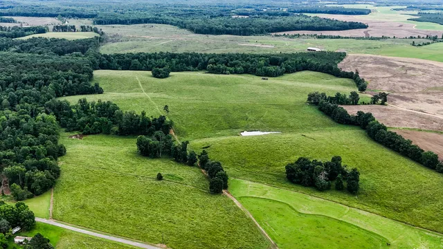 an aerial view of a golf course with a garden