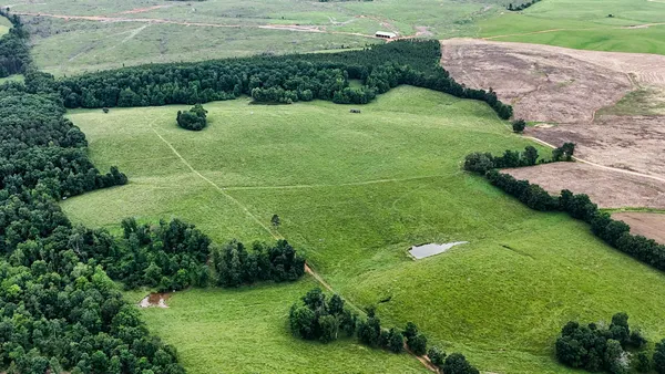 a view of a lake with a yard