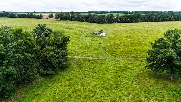 a view of a lake with a yard