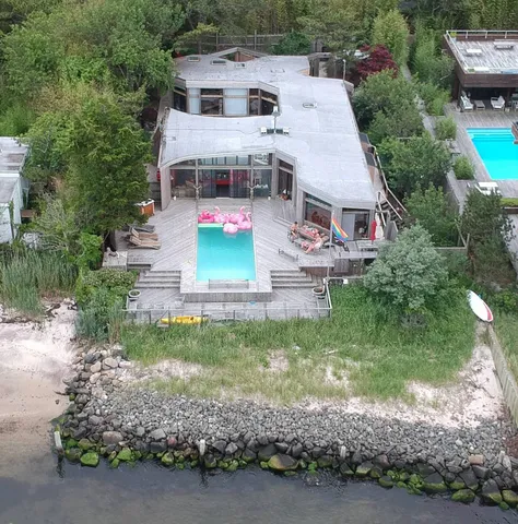 an aerial view of a house with a yard