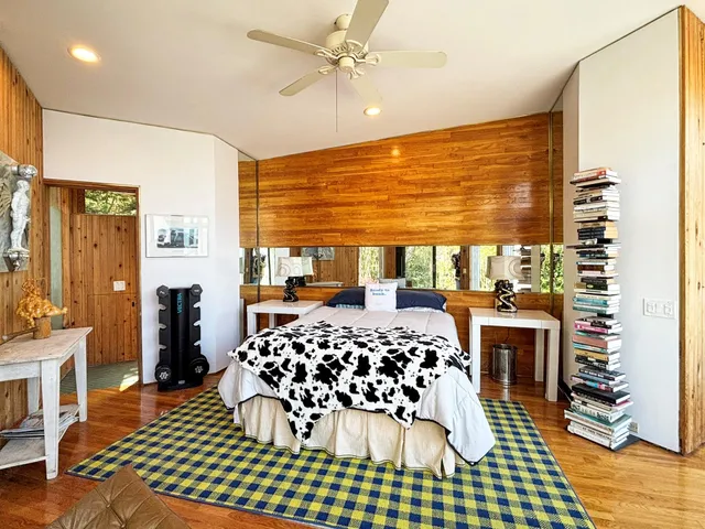 a bedroom with a bed and a table with closet