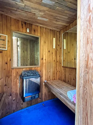 a bedroom with furniture and a wooden floor