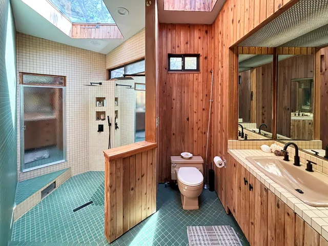 a spacious bathroom with a bathtub sink and toilet