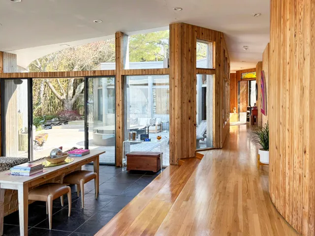a view of a livingroom with furniture and wooden floor