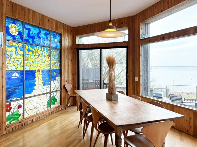 a view of a dining room with furniture window and outside view