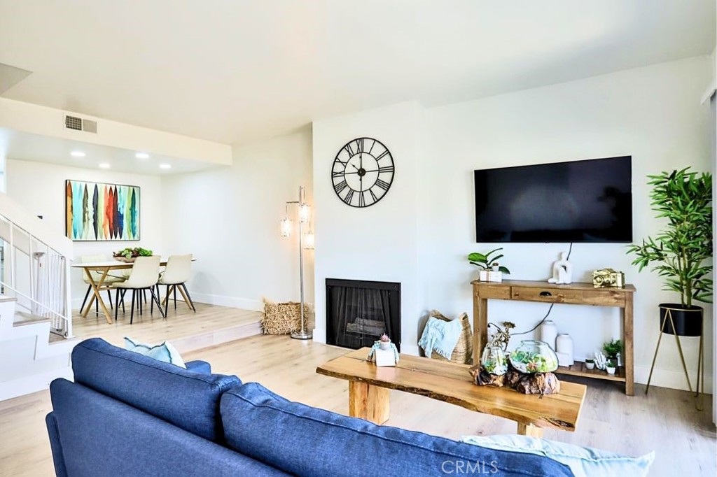 830 West Lambert Road, Unit E La Habra, CA 90631 - Photo 1 of 1 a living room with furniture and a flat screen tv