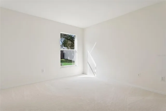 a view of a house with a yard and porch