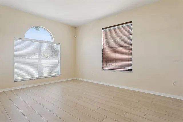 a view of an empty room with a window
