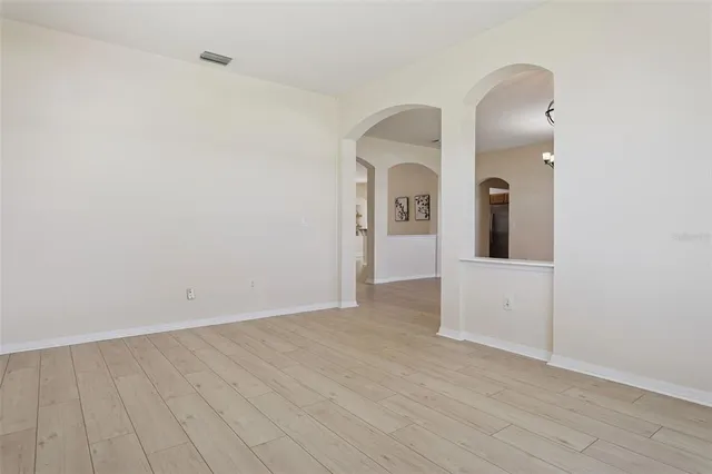 a kitchen with kitchen island granite countertop a sink stainless steel appliances and cabinets