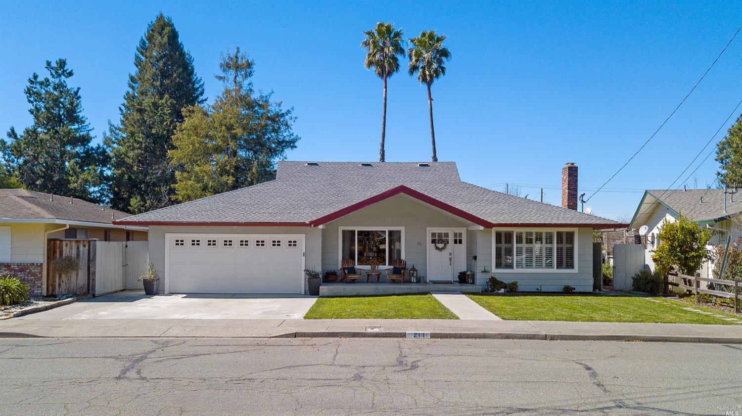 211 Grove Avenue Santa Rosa, CA 95409 - Photo 1 of 1 a house with palm trees in front of it