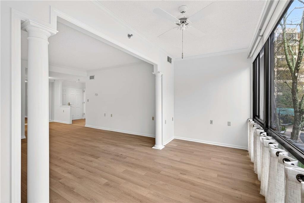 1800 Clairmont Lake, Unit A227 Decatur, GA 30033 - Photo 19 of 69 a view of a room with wooden floor and a ceiling fan