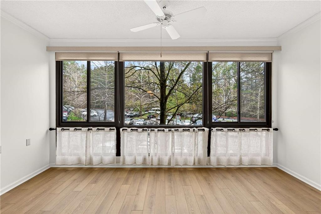 1800 Clairmont Lake, Unit A227 Decatur, GA 30033 - Photo 21 of 69 an empty room with wooden floor and windows