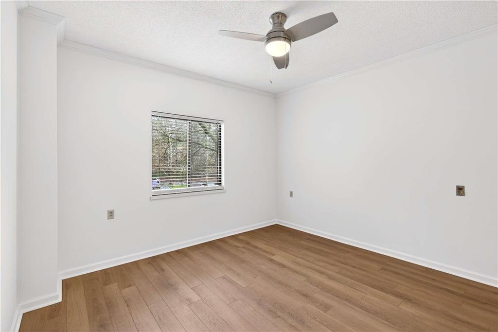 1800 Clairmont Lake, Unit A227 Decatur, GA 30033 - Photo 27 of 69 an empty room with a window and a ceiling fan
