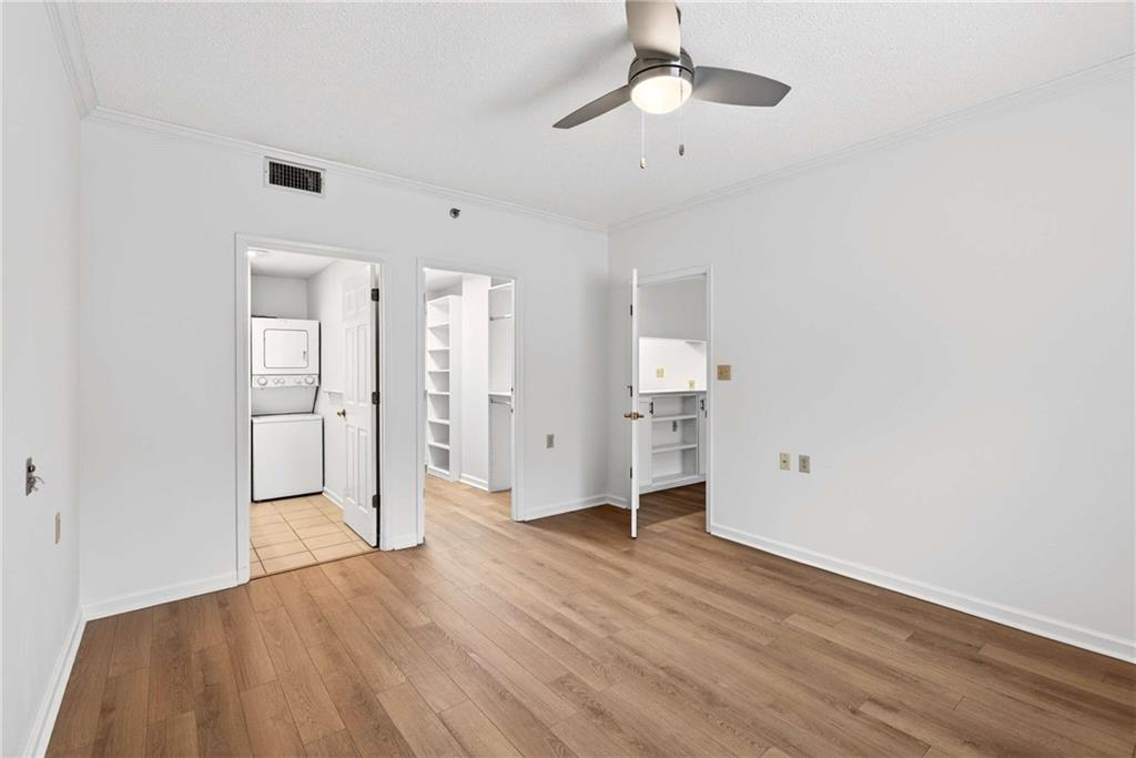 1800 Clairmont Lake, Unit A227 Decatur, GA 30033 - Photo 29 of 69 a view of empty room with wooden floor and ceiling fan