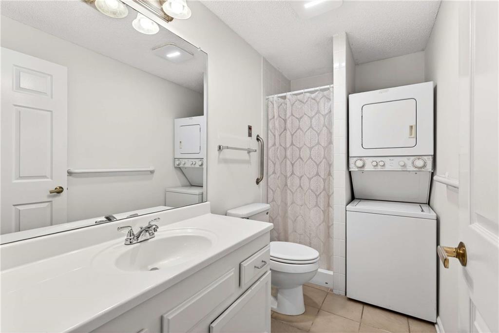 1800 Clairmont Lake, Unit A227 Decatur, GA 30033 - Photo 31 of 69 a bathroom with a sink a toilet and shower