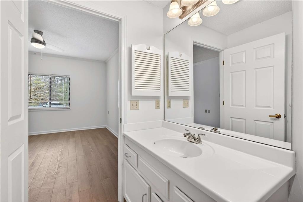1800 Clairmont Lake, Unit A227 Decatur, GA 30033 - Photo 32 of 69 a bathroom with a sink and a mirror