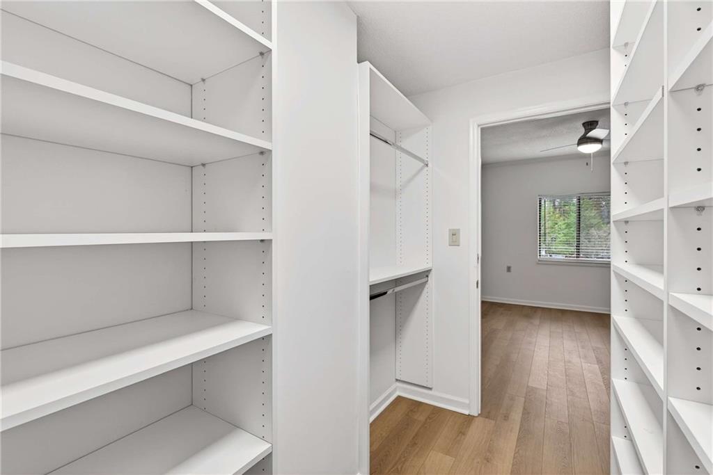 1800 Clairmont Lake, Unit A227 Decatur, GA 30033 - Photo 34 of 69 a view of an empty room with a window and wooden floor