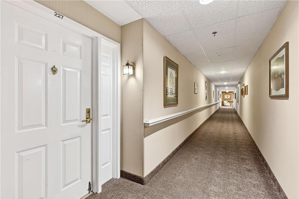 1800 Clairmont Lake, Unit A227 Decatur, GA 30033 - Photo 4 of 69 a view of a hallway with wooden floor and staircase