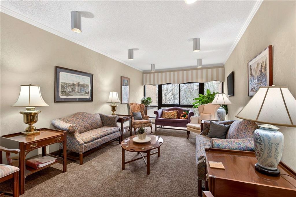 1800 Clairmont Lake, Unit A227 Decatur, GA 30033 - Photo 47 of 69 a living room with furniture a lamp on a rug and a lamp