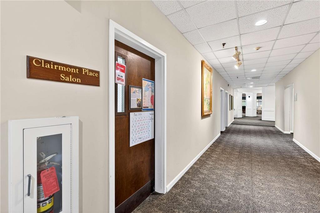 1800 Clairmont Lake, Unit A227 Decatur, GA 30033 - Photo 56 of 69 a view of a hallway with wooden floor and windows