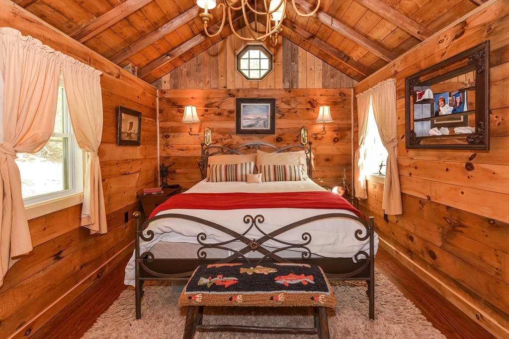 38 Cote Lane Sutton, MA 01590 - Photo 17 of 33 a bedroom with a bed and wooden floor