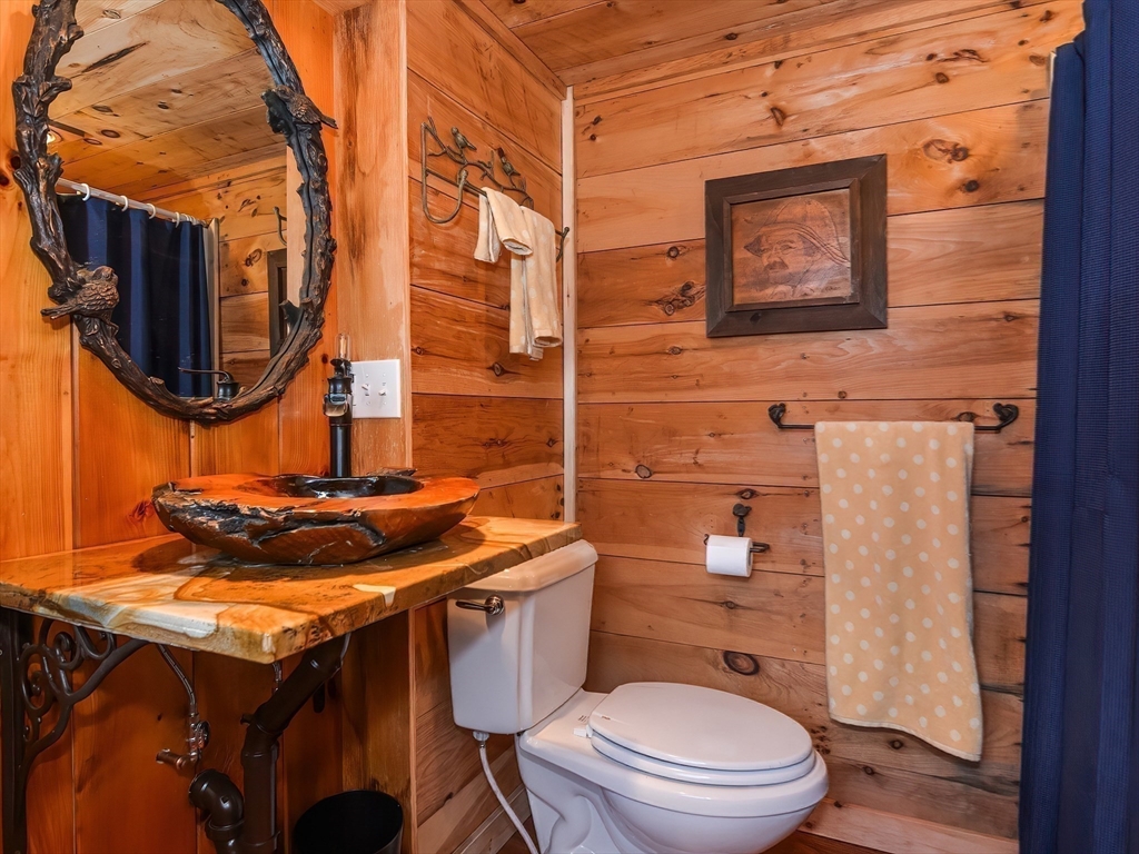 38 Cote Lane Sutton, MA 01590 - Photo 18 of 33 a bathroom with a granite countertop toilet sink and mirror