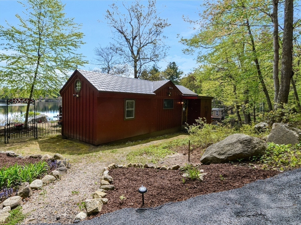 38 Cote Lane Sutton, MA 01590 - Photo 24 of 33 a front view of a house with a yard