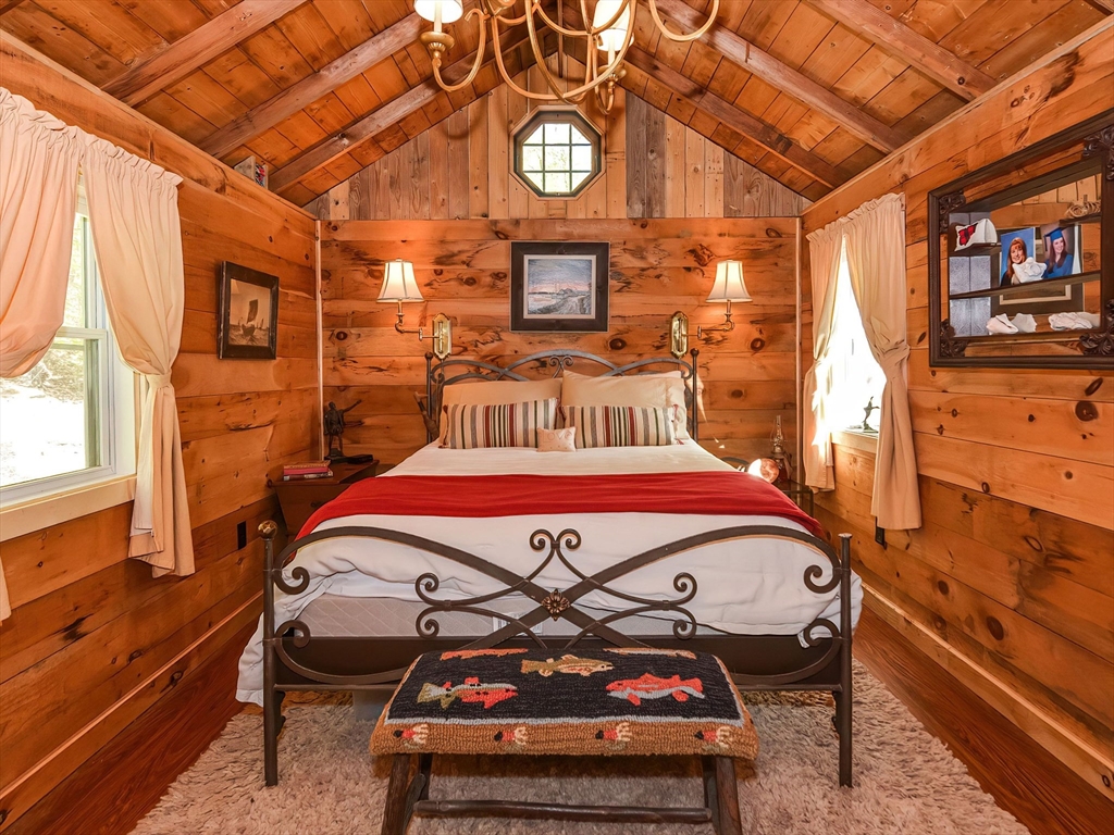 38 Cote Lane Sutton, MA 01590 - Photo 30 of 33 a bedroom with a bed and wooden floor