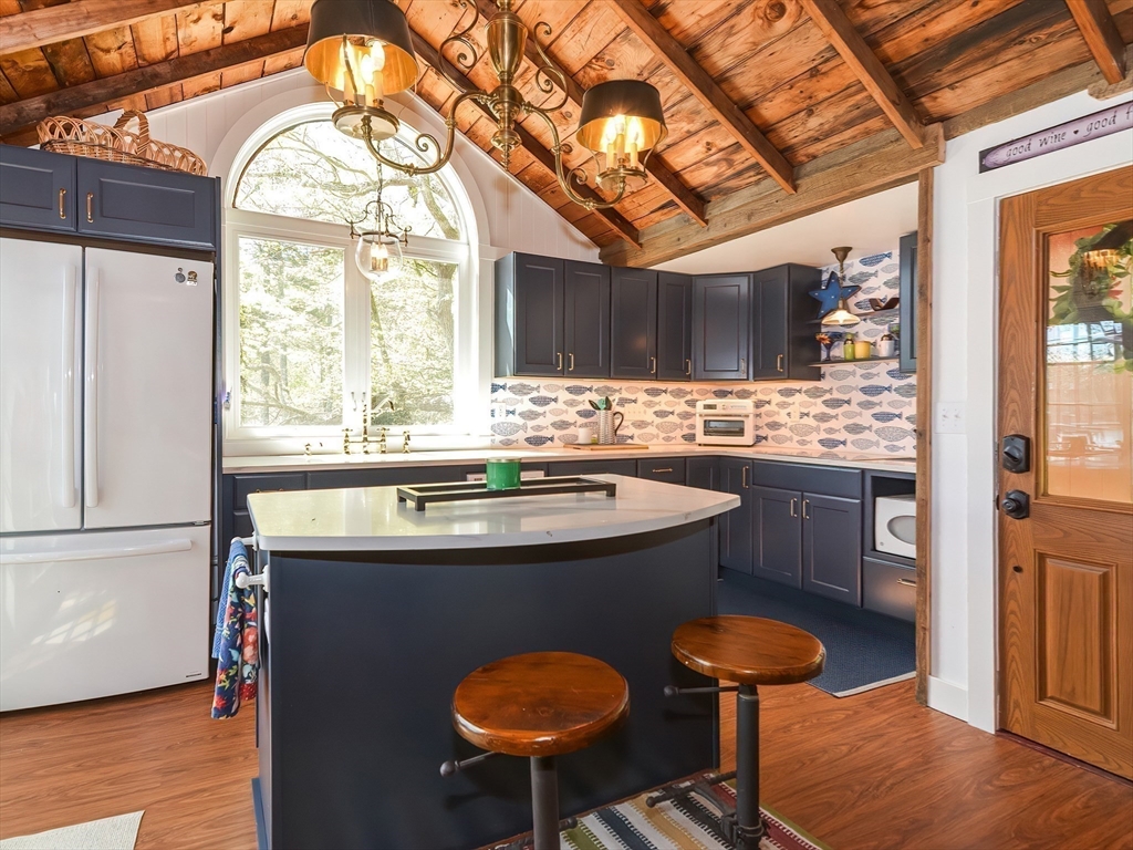 38 Cote Lane Sutton, MA 01590 - Photo 3 of 33 a kitchen with stainless steel appliances granite countertop a sink a stove and a refrigerator