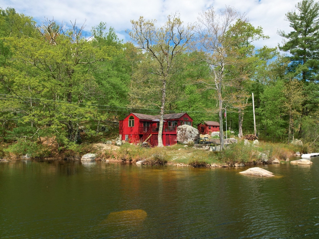 38 Cote Lane Sutton, MA 01590 - Photo 32 of 33 a view of a lake with a house swimming pool and outdoor space
