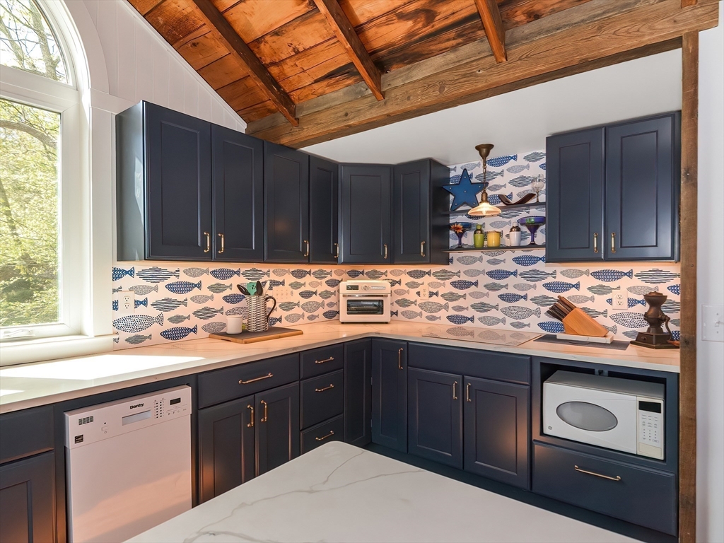 38 Cote Lane Sutton, MA 01590 - Photo 5 of 33 a kitchen with a sink and cabinets
