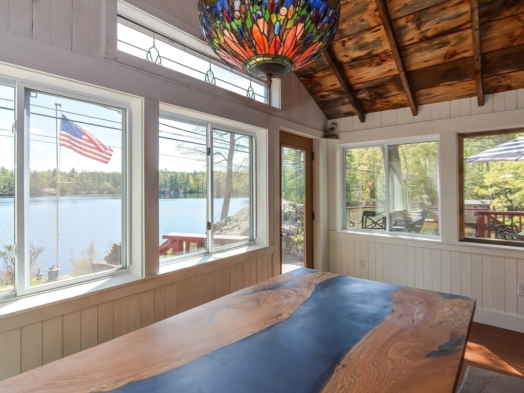 38 Cote Lane Sutton, MA 01590 - Photo 10 of 33 a living room with a large bed and a large window with outer view