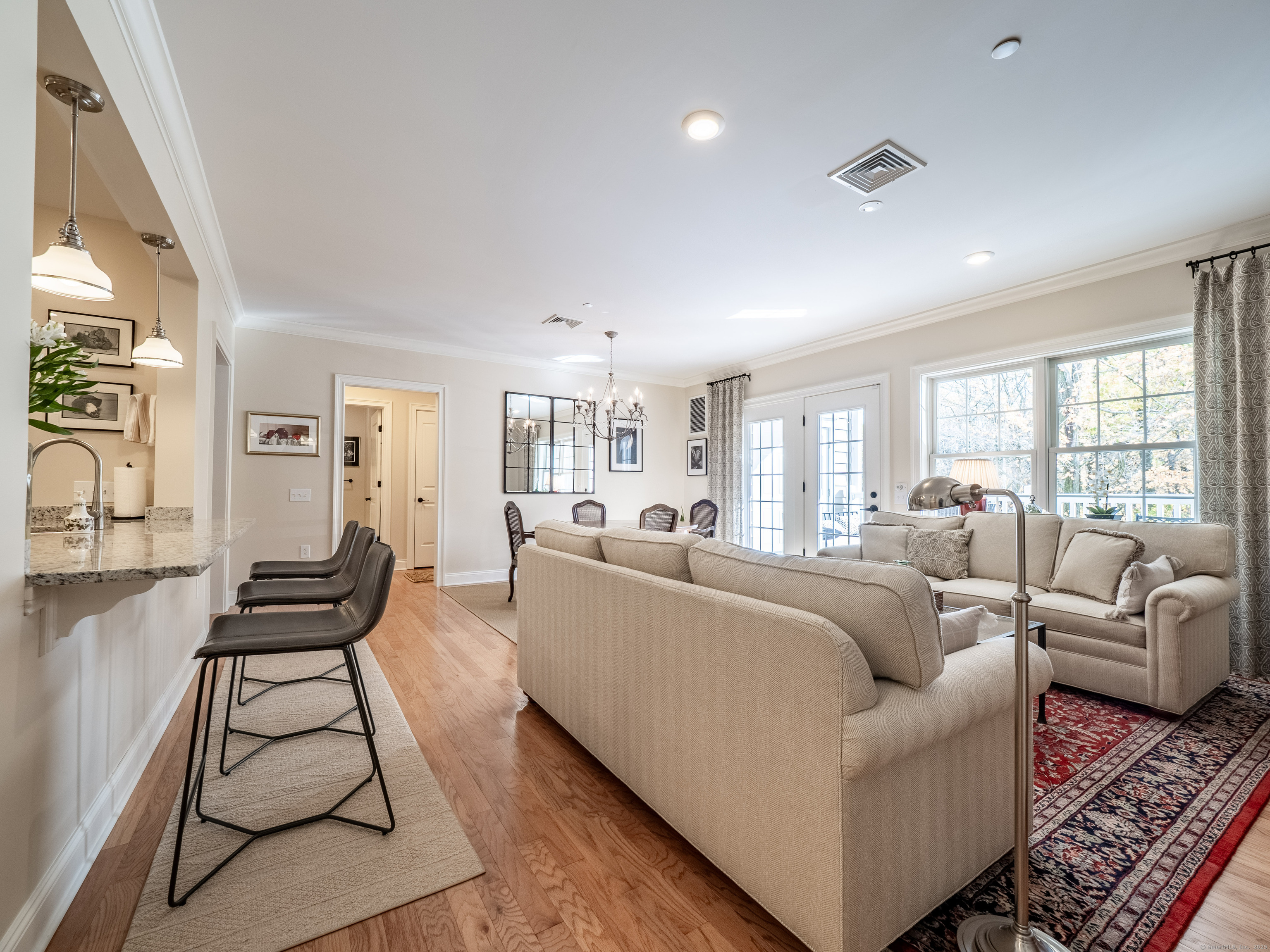 77 Sunset Lane, Unit 223 Ridgefield, CT 06877 - Photo 11 of 38 a living room with furniture and a large window