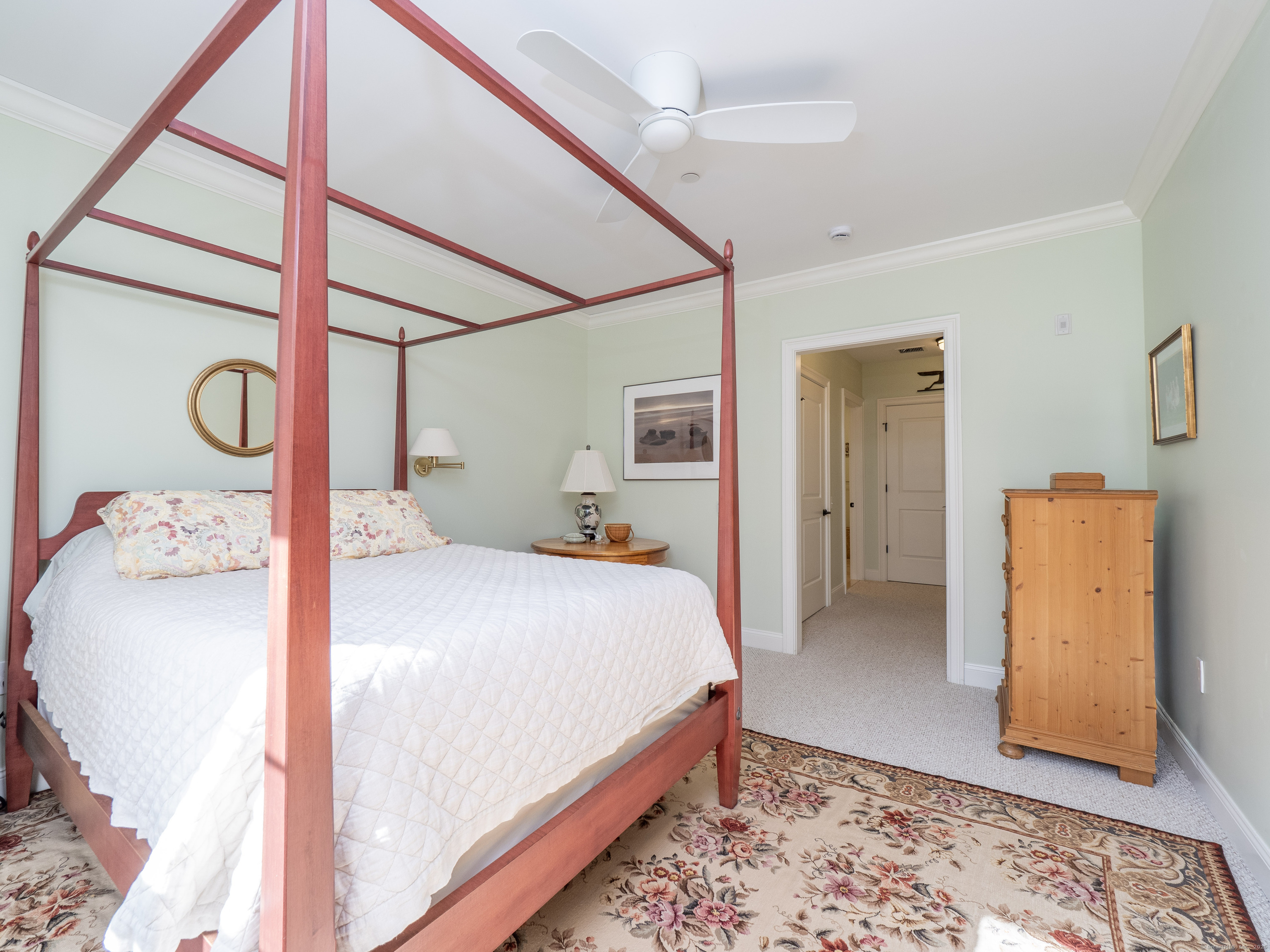 77 Sunset Lane, Unit 223 Ridgefield, CT 06877 - Photo 17 of 38 a bedroom with a bed and a table