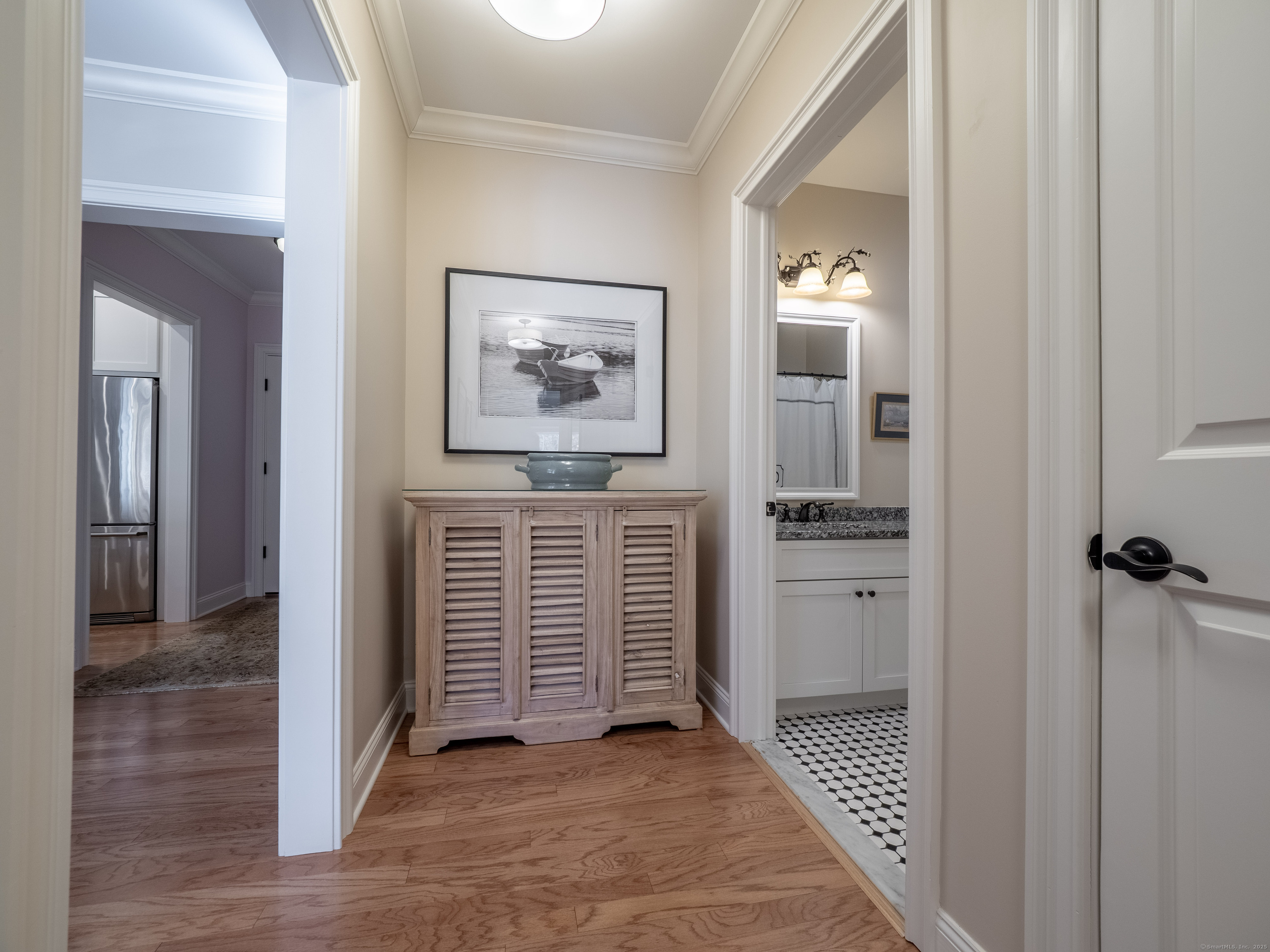 77 Sunset Lane, Unit 223 Ridgefield, CT 06877 - Photo 23 of 38 a view of a hallway with closet and a bathroom