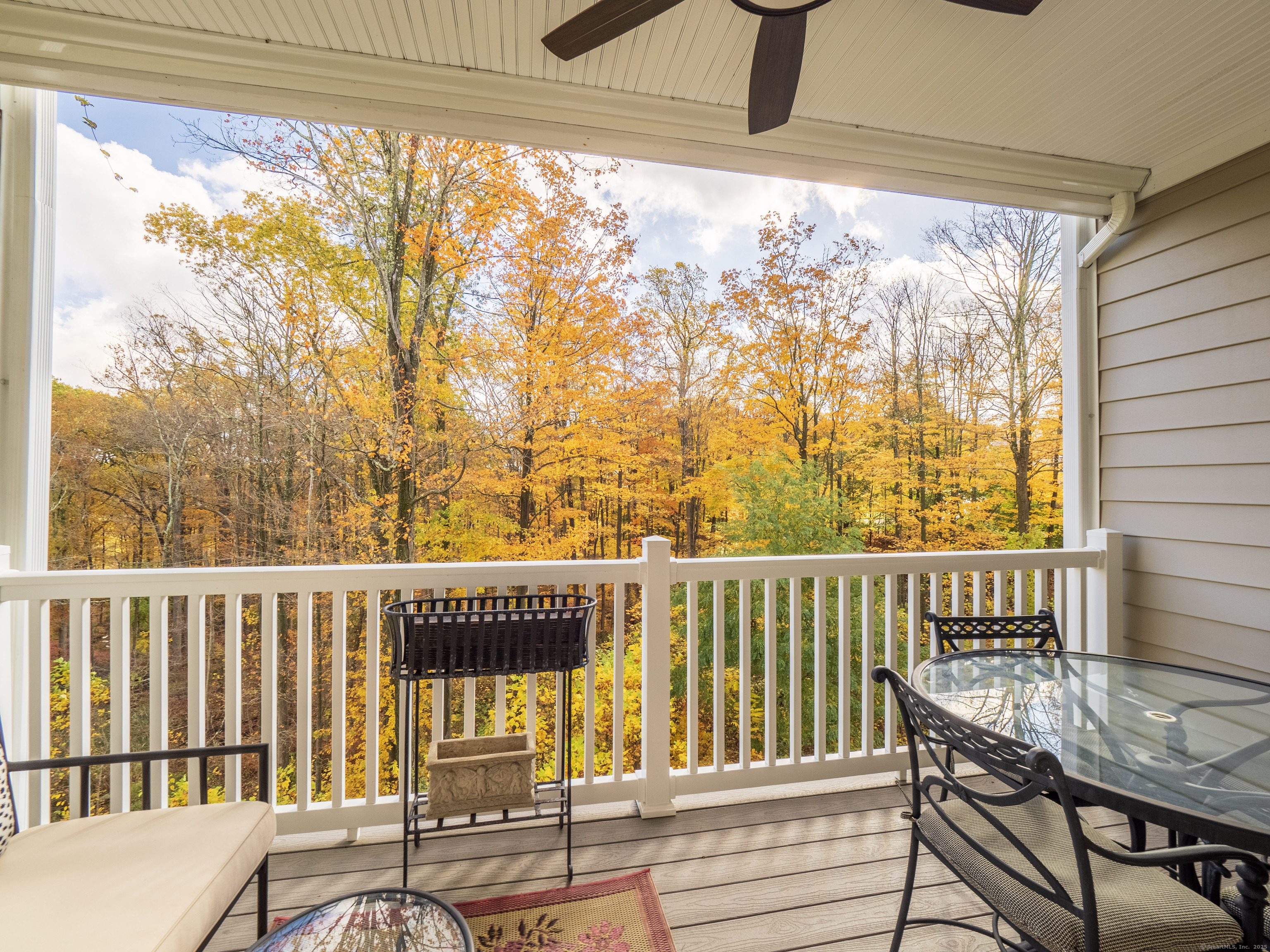 77 Sunset Lane, Unit 223 Ridgefield, CT 06877 - Photo 27 of 38 a view of a chair and table in the balcony