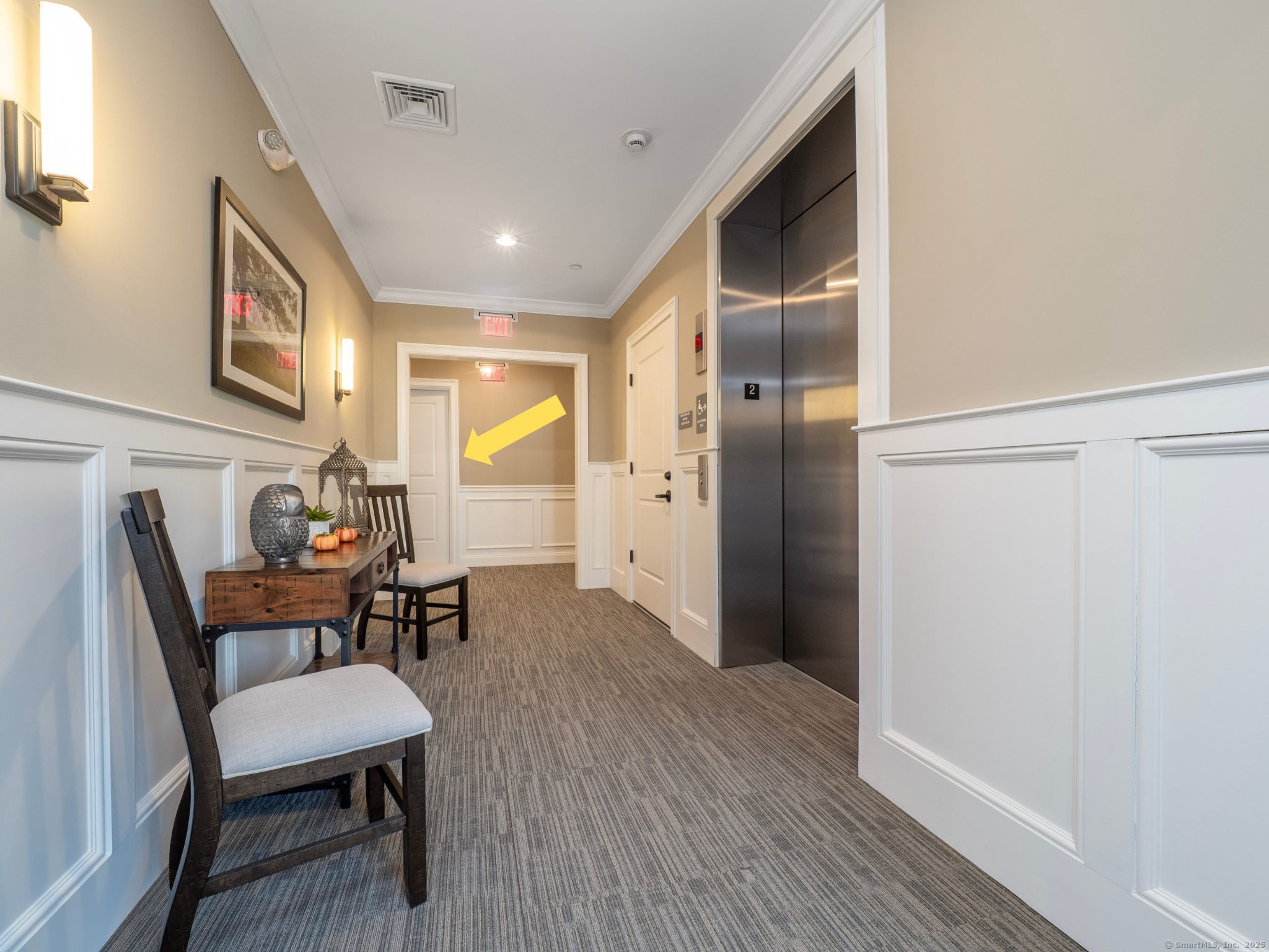 77 Sunset Lane, Unit 223 Ridgefield, CT 06877 - Photo 3 of 38 a view of a livingroom with furniture and wooden floor