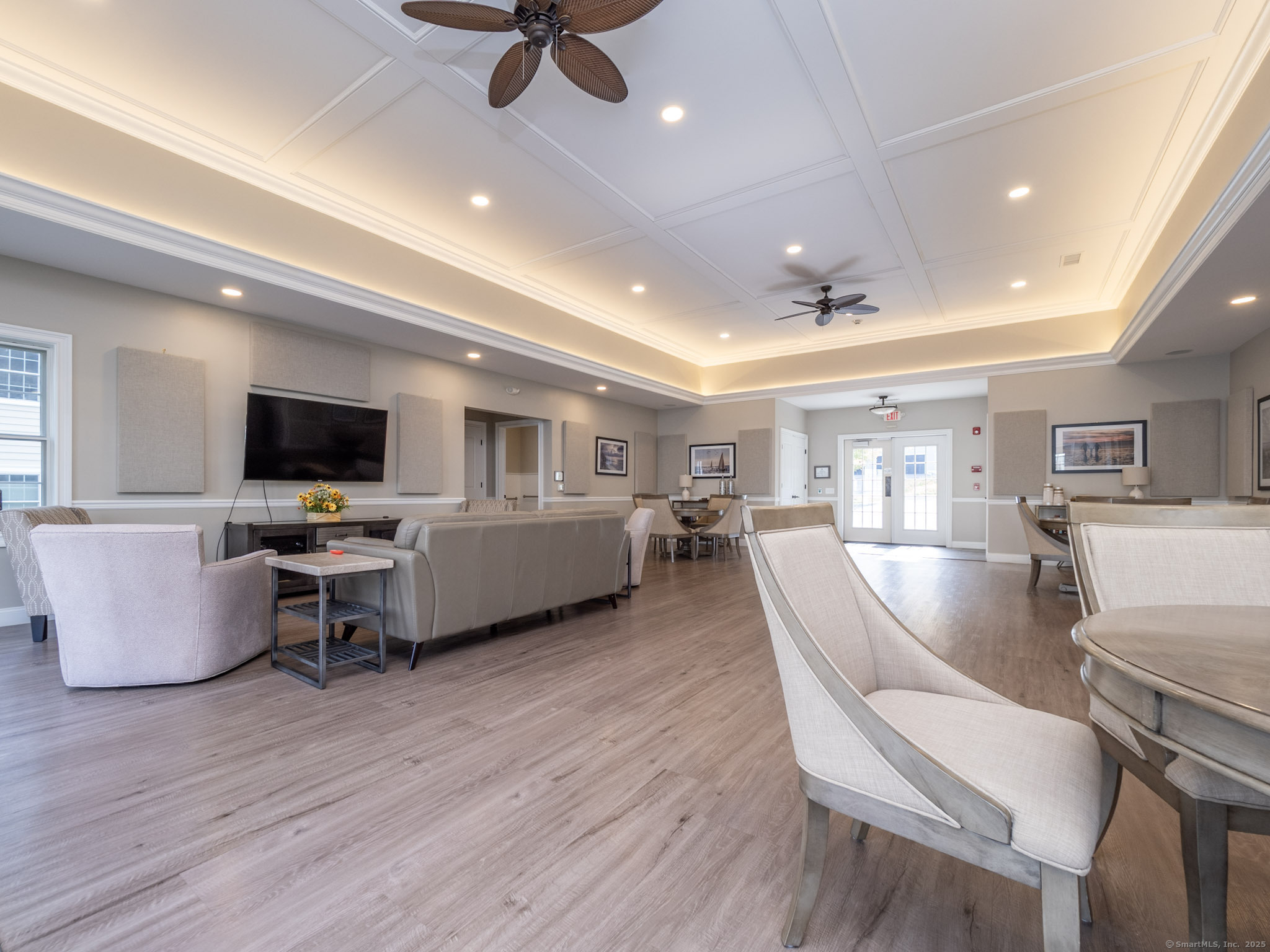 77 Sunset Lane, Unit 223 Ridgefield, CT 06877 - Photo 33 of 38 a living room with furniture and a flat screen tv