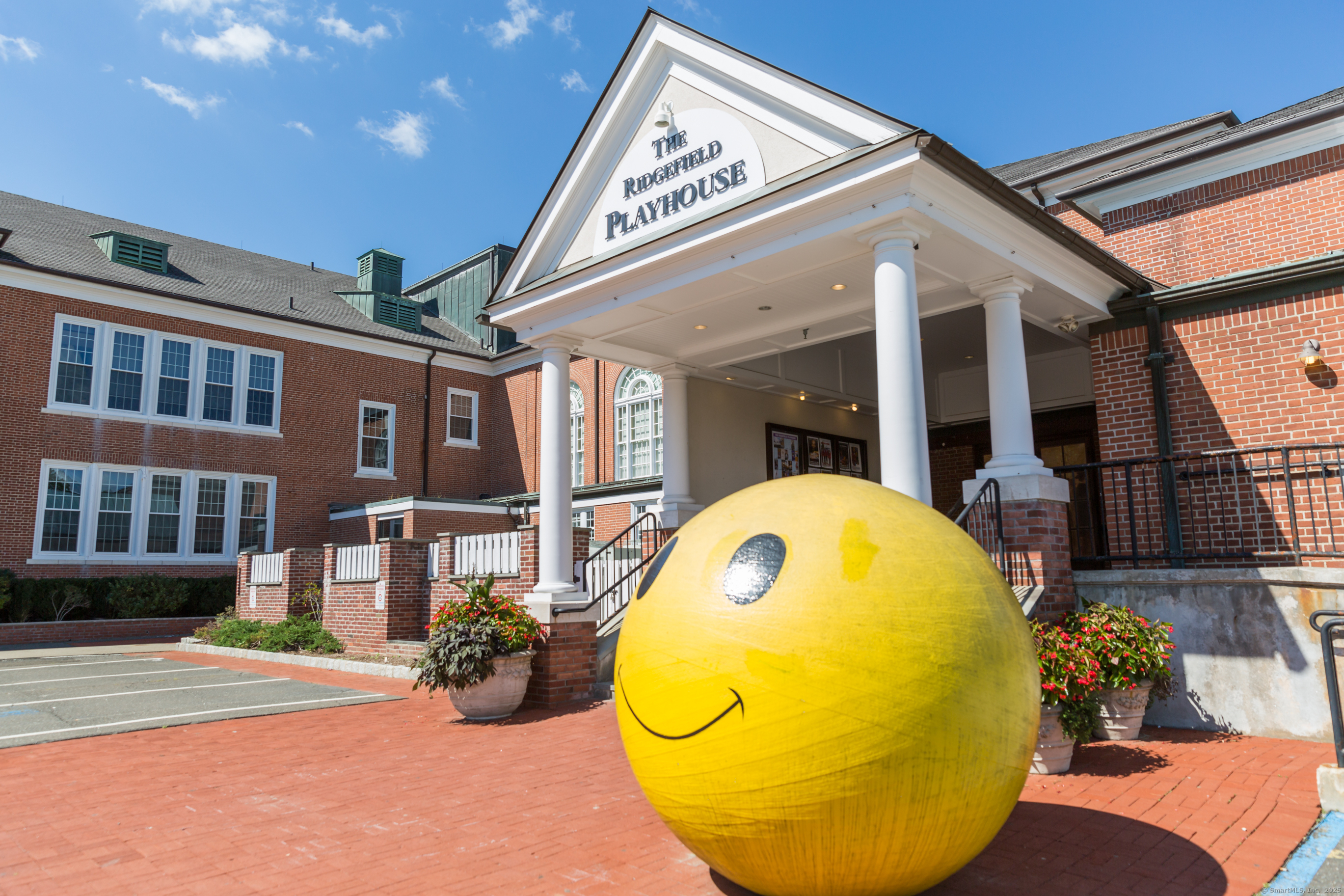 77 Sunset Lane, Unit 223 Ridgefield, CT 06877 - Photo 37 of 38 a view of a patio with table and chairs potted plants and wooden floor