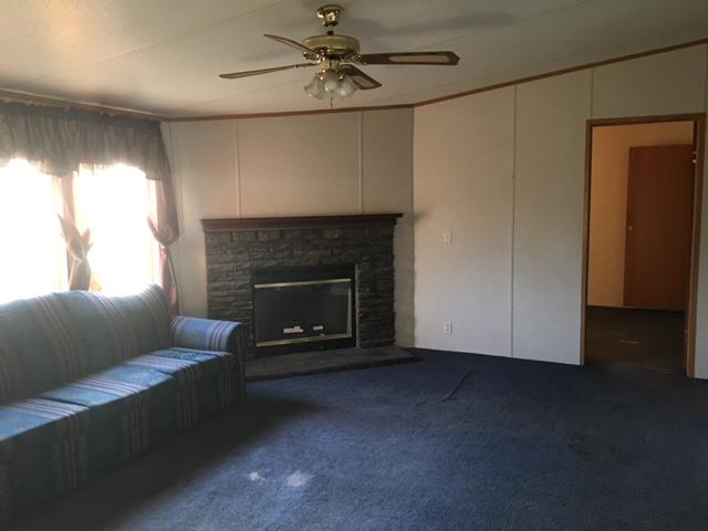 1245 McDearmon Road Montvale, VA 24122 - Photo 12 of 12 a living room with furniture and a fireplace