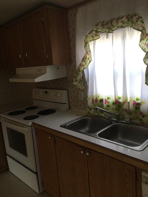 1245 McDearmon Road Montvale, VA 24122 - Photo 9 of 12 a kitchen that has a sink and a stove